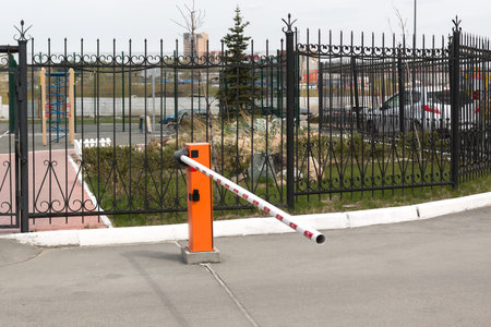 iron forged fence and automatic barrier