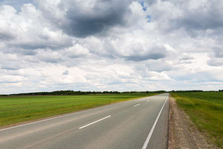 Asphalt road without cars in summerの写真素材
