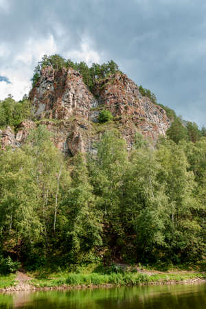 landscape in the mountains, trees and rocksの写真素材