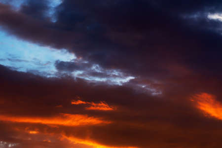 The evening sky with clouds at sunset is the beginning of the nightの写真素材