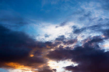 bright beautiful evening sky with clouds at sunsetの写真素材