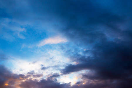 bright beautiful evening sky with clouds at sunsetの写真素材