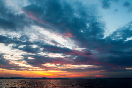 The evening sky with clouds at sunset is the beginning of the nightの写真素材