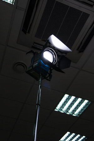 professional video light. a large spotlight on the rack included