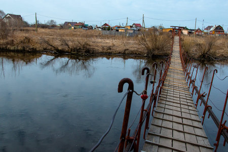 small pedestrian bridge to cross the riverの写真素材