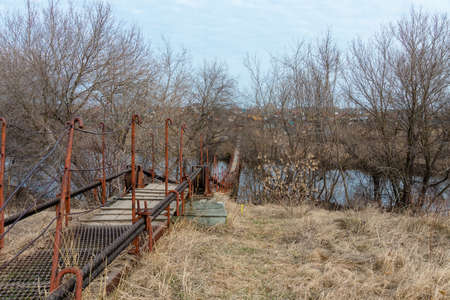 small pedestrian bridge to cross the riverの写真素材