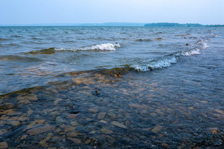 small wave on the lake in cloudy weather