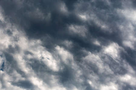 gloomy stormy sky with heavy dark cloudsの写真素材
