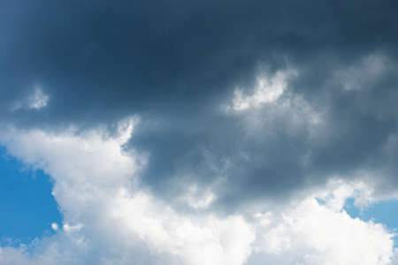 gloomy stormy sky with heavy dark cloudsの写真素材