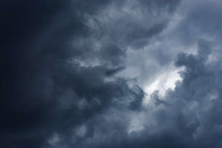 gloomy stormy sky with heavy dark cloudsの写真素材