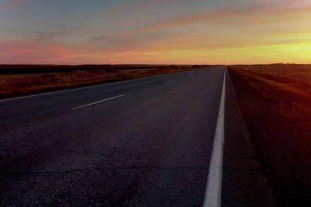sunset road on a background of colorful sky iの写真素材