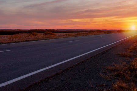 sunset road on a background of colorful sky iの写真素材