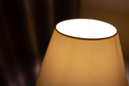 floor lamp stands near curtains closeupの写真素材