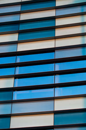 Facades of modern buildings made of glass and concreteの写真素材