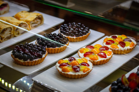 Dessert colorfully decorated in a cafe shop window. It's time to eatの写真素材