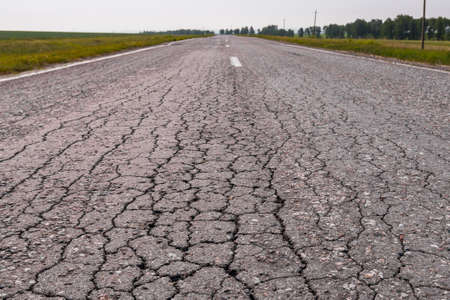 asphalt road for cars goes far into the horizonの写真素材