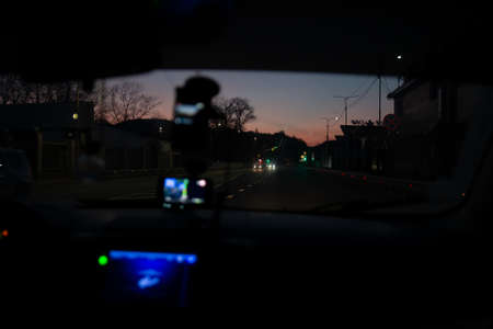 view through the windshield of the car on the road at night iの写真素材