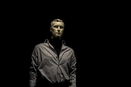 mannequin man in shirt isolated on black backgroundの写真素材