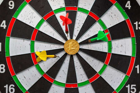 Litecoinc cryptocurrency in the center of darts. Right on target.の写真素材