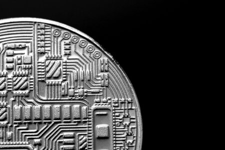 the stamp with the image of the electronic board on the coin is the reverse side of the souvenir bitcoin coinの写真素材