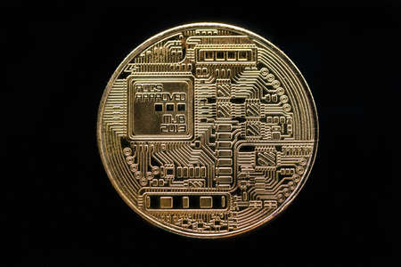 the stamp with the image of the electronic board on the coin is the reverse side of the souvenir bitcoin coinの写真素材