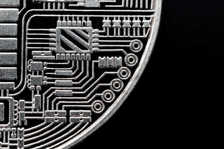 the stamp with the image of the electronic board on the coin is the reverse side of the souvenir bitcoin coinの写真素材