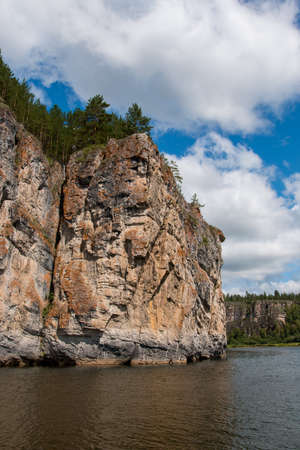 Rocks on the banks of a mountain river in summerの写真素材