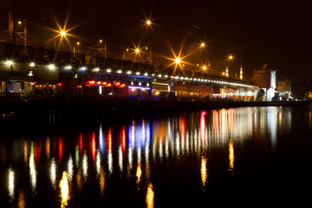 People have fun at cafes and restaurant on Galata Bridge in Istanbul, Turkey