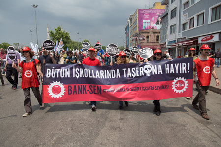 ISTANBUL, TURKEY - MAY 25, 2014: Unions march in protest against subcontractors in Turkey. No to subcontractors in all sectors write on banner.のeditorial素材