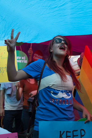 ISTANBUL, TURKEY - JUNE 22, 2014: Girl in 5. Trans Pride March held in Istiklal Avenue, Istanbul. Thousands of people gathered to celebrate begining of LGBT Honor week.のeditorial素材