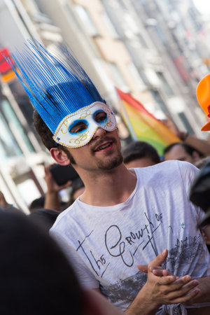 ISTANBUL, TURKEY - JUNE 22, 2014: Man with mask in 5. Trans Pride March held in Istiklal Avenue, Istanbul. Thousands of people gathered to celebrate begining of LGBT Honor week.のeditorial素材