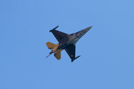 IZMIT, TURKEY - JUNE 28, 2014: Turkish Air Force Solo Aerobatics Display Team Solo Turk performs. Solo Turk airplane is a F-16 C Blok-40 fighter jet.のeditorial素材
