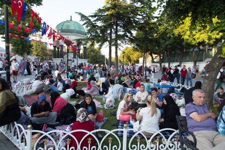 ISTANBUL, TURKEY - JULY 05, 2014: People waiting to break one's fast during Ramandan in Sultanahmet square, Istanbulのeditorial素材