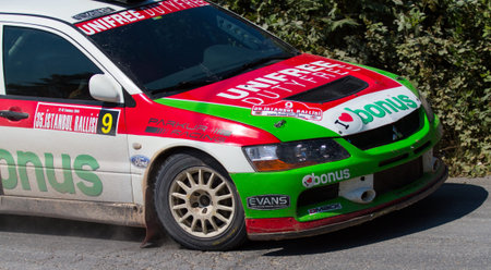 ISTANBUL, TURKEY - JULY 13, 2014: Ercan Kazaz drives Mitsubishi Lancer Evo 9 of Bonus Unifree Parkur Racing Team in 35. Istanbul Rally, Ulupelit ITO Stageのeditorial素材