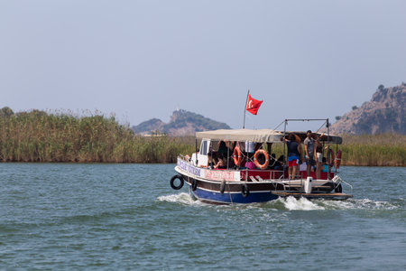 DALYAN, MUGLA, TURKEY - JULY 18, 2014: People in Dalyan river tour. River tour between Koycegiz lake and Iztuzu beach is one of the most populer activity in Dalyan.のeditorial素材