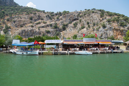 GOCEK, MUGLA, TURKEY - JULY 18, 2014: Fish restaurants in coats of Dalyan river. Fishing is one of the most important industry for Dalyan.のeditorial素材