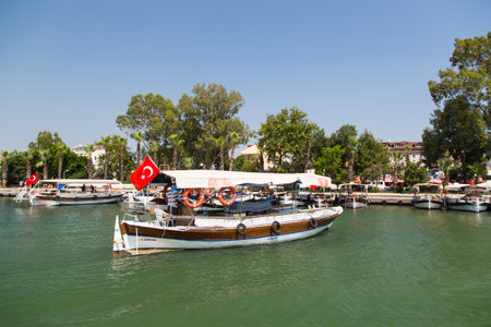 DALYAN, MUGLA, TURKEY - JULY 18, 2014: Tour boats in Dalyan river. River tour between Koycegiz lake and Iztuzu beach is one of the most populer activity in Dalyan.のeditorial素材