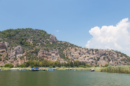 DALYAN, MUGLA, TURKEY - JULY 19, 2014: Tour boat in Dalyan river. River tour between Koycegiz lake and Iztuzu beach is one of the most populer activity in Dalyan.のeditorial素材