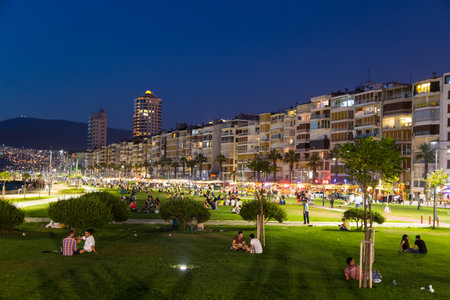 IZMIR, TURKEY - JULY 21, 2014: People on grass in Kordon side of Izmir where is one of the most popular destination for entertainment in Izmir.のeditorial素材