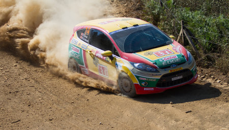 ISTANBUL, TURKEY - AUGUST 16, 2014: Bugra Banaz drives Ford Fiesta R2 car of Castrol Ford Team Turkiye in Avis Bosphorus Rally, Mudarli Stageのeditorial素材