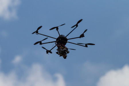 A Black Octocopter is flying with a Camera