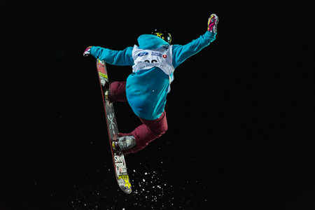 ISTANBUL, TURKEY - DECEMBER 20, 2014: Cheryl Maas jump in FIS Snowboard World Cup Big Air. This is first Big Air event for both, men and women.のeditorial素材