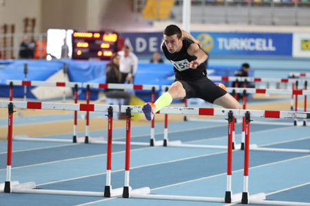 ISTANBUL, TURKEY - DECEMBER 28, 2014: Athlete Kerem Colak Steeplechase running during Athletics...