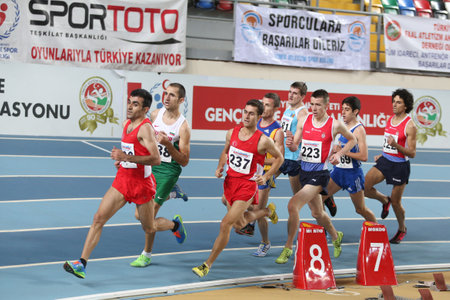 ISTANBUL, TURKEY - FEBRUARY 21, 2015: Athletes run during Balkan Athletics Indoor Championships in Asli Cakir Alptekin Athletics hall.のeditorial素材