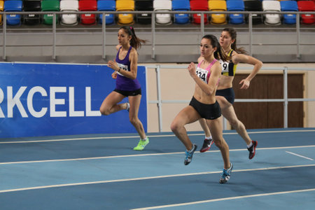 ISTANBUL, TURKEY - FEBRUARY 15, 2015: Athletes running during Turkcell Juniors and Seniors Athletics Turkey Indoor Championship in Asli Cakir Alptekin Athletics hallのeditorial素材