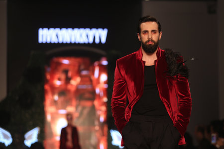 ISTANBUL, TURKEY - MARCH 18, 2015: A model showcases one of the latest creations by Hakan Akkaya in Mercedes-Benz Fashion Week Istanbulのeditorial素材
