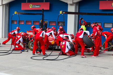 ISTANBUL, TURKEY - OCTOBER 26, 2014: Pit stop of Formula 1 car in Ferrari Racing Days in Istanbul Park Racing Circuit ISTANBUL, TURKEY - OCTOBER 26, 2014: Pit stop of Formula 1 car in Ferrari Racing Days in Istanbul Park Racing Circuit