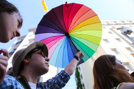 ISTANBUL, TURKEY - JUNE 21, 2015: Man with LGBT umbrella during Istanbul Trans Pride March in Istiklal Avenue at the beginning of Istanbul LGBT Pride Week.のeditorial素材