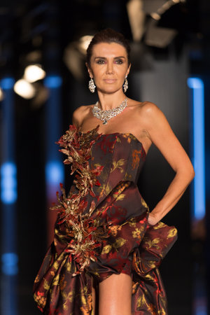 ISTANBUL, TURKEY - NOVEMBER 21, 2014: A model showcases one of the latest creations by Priamos in Fashionist fashion fairのeditorial素材