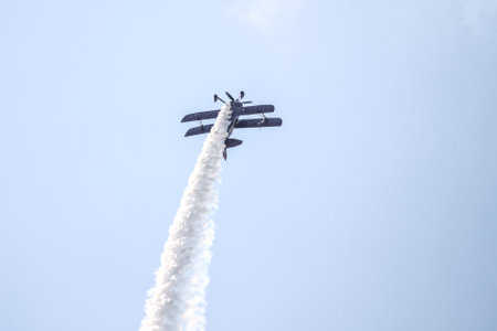 ISTANBUL, TURKEY - AUGUST 02, 2015: Ali Ismet Ozturk piloting his special biplane called Purple Violet at the TATCA Airfest 2015のeditorial素材
